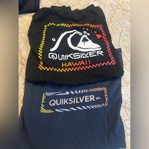 Two boy t-shirts. Quiksilver. One black and one navy blue.